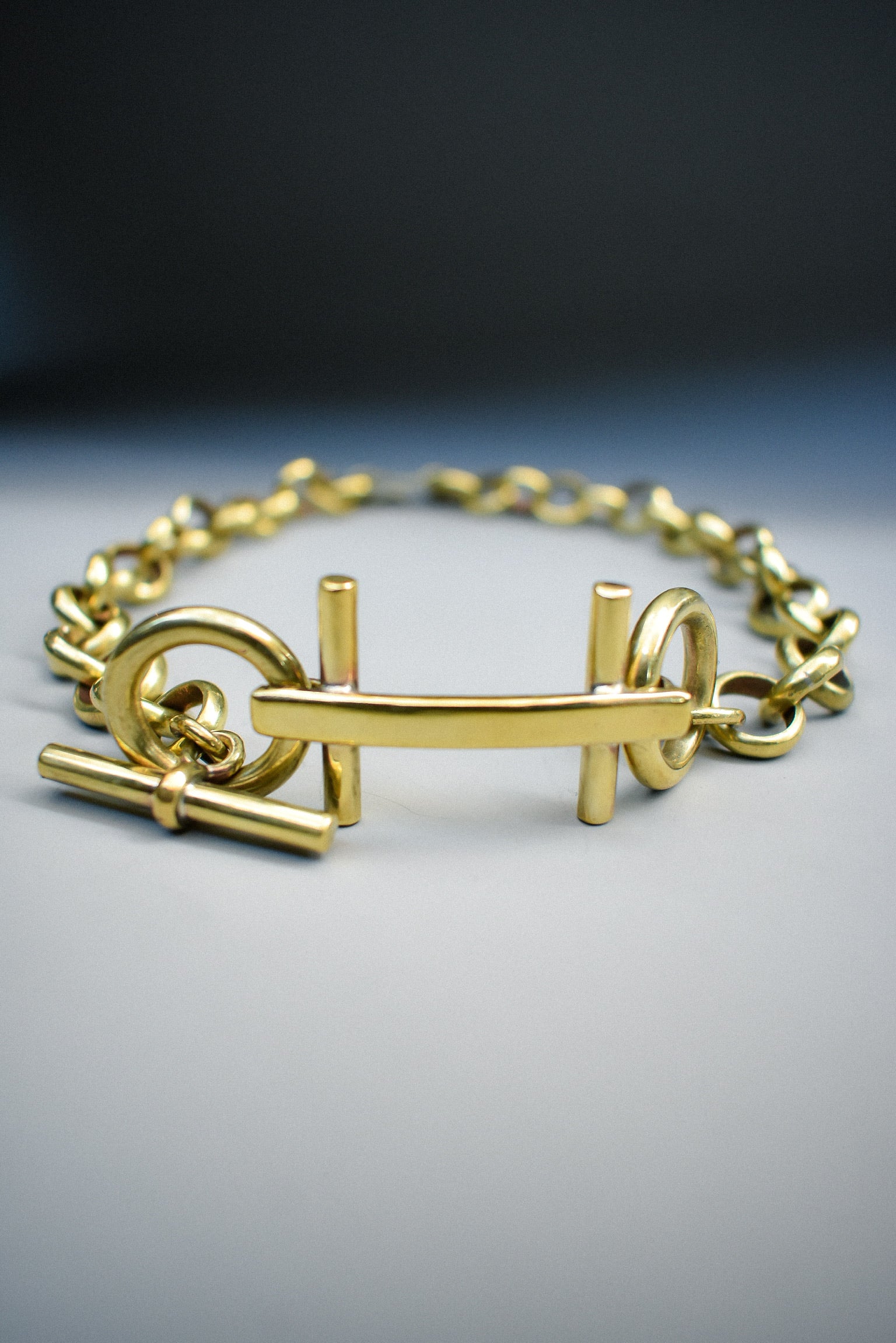 Collar H Bronce 
